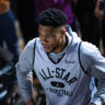 Giannis Antetokounmpo blocking a shot during a Milwaukee bucks game.